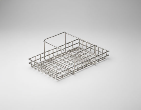 Shallow stainless steel wire mesh basket with a raised handle divider on one end and grid base, on a grey gradient background